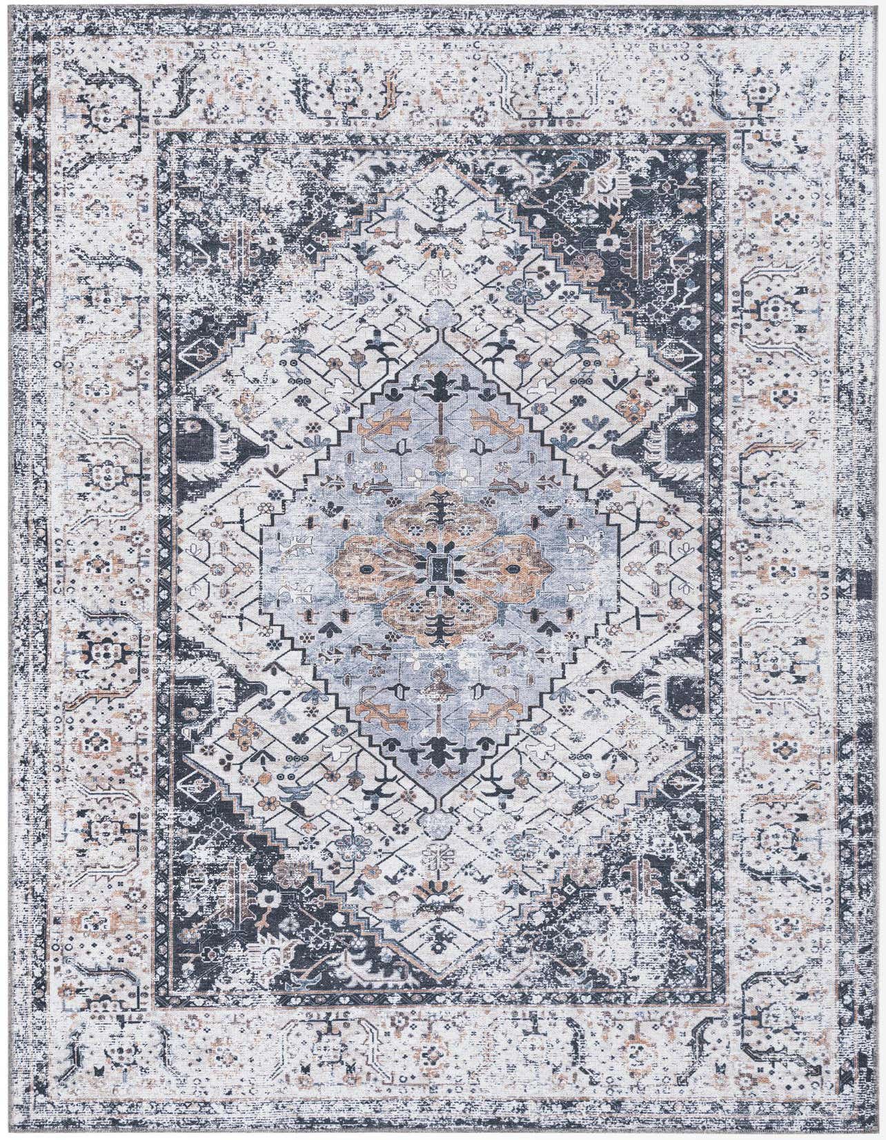 A 5x8 rectangular black, ivory, and gray tribal medallion rug with a distressed bohemian pattern, suitable for a living room.