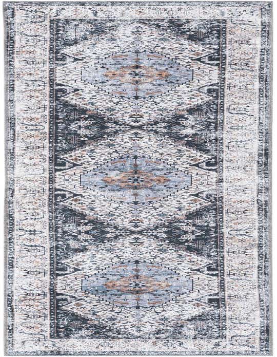 A 10 ft runner rug with a distressed black, ivory, and gray tribal medallion pattern, ideal for a hallway.