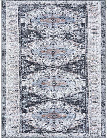 A 16 ft runner rug featuring a distressed tribal medallion pattern in black, ivory, cream, gray, and silver, ideal for a hallway.
