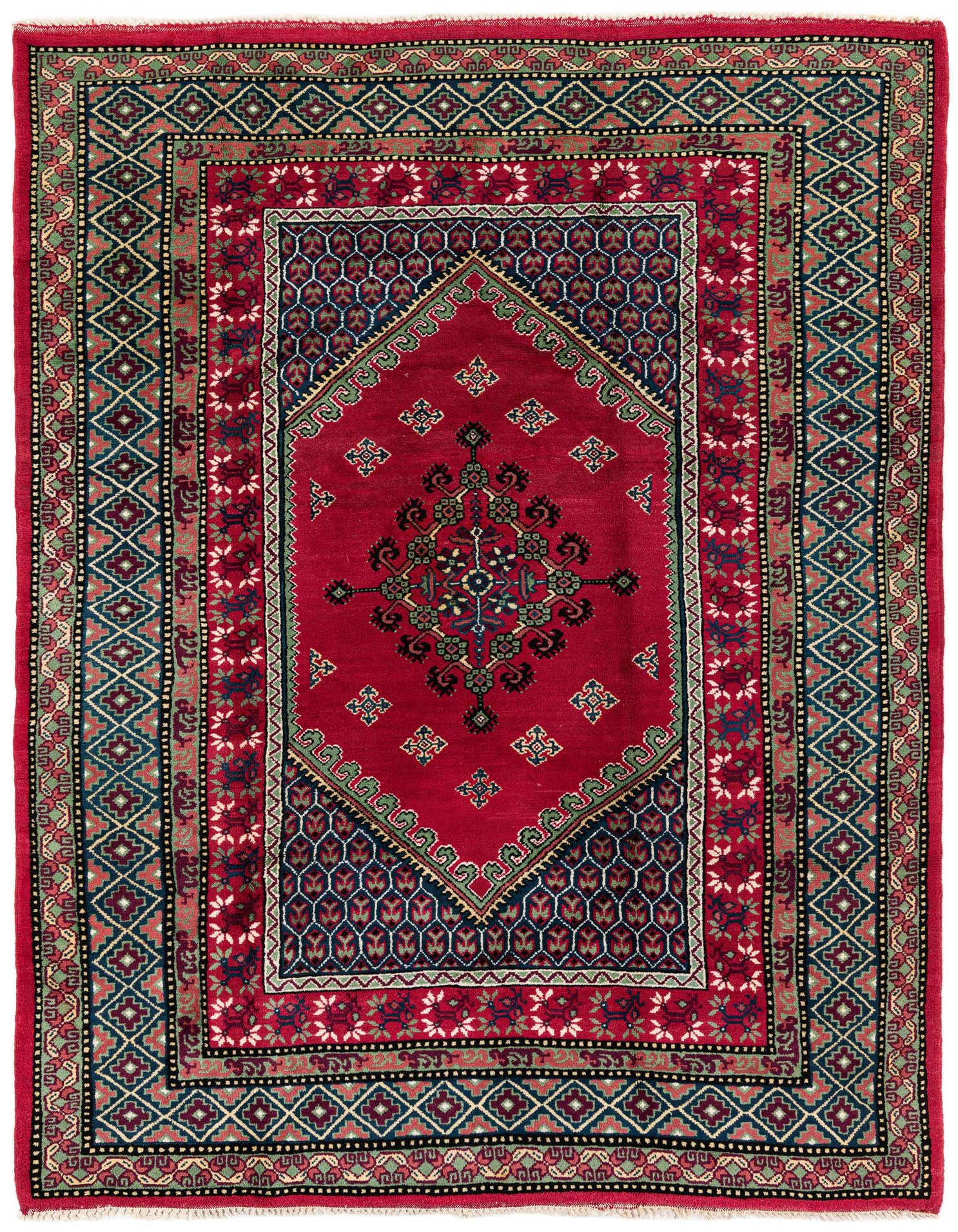 A 7x10 rectangular pink and red wool rug with a central medallion and intricate tribal patterns.