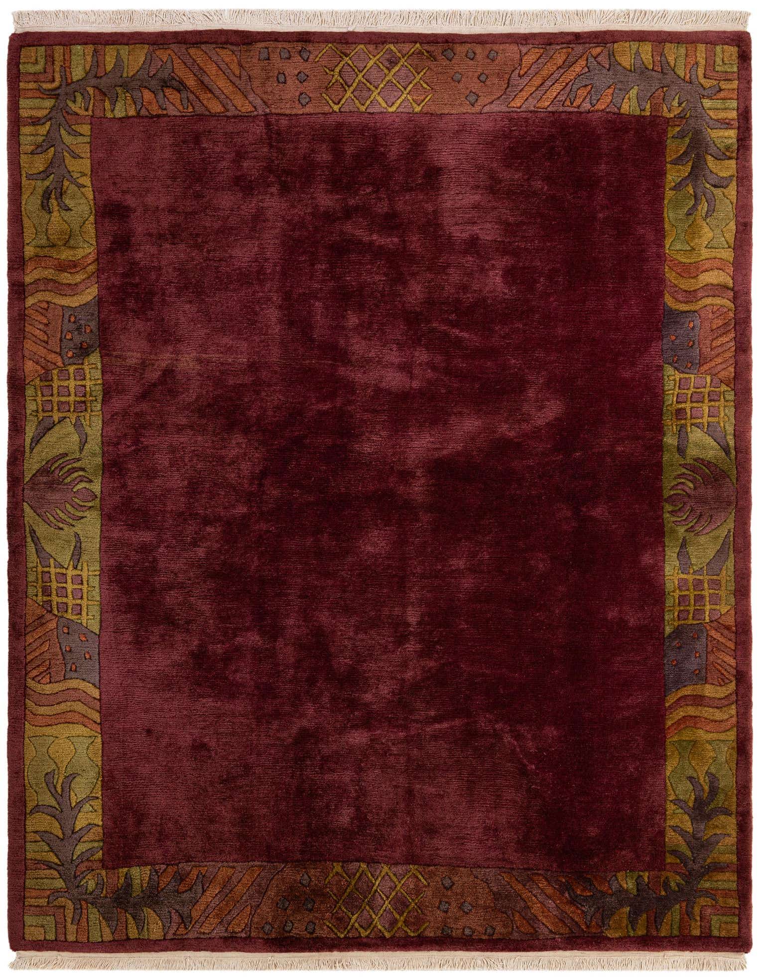 A 6x9 rectangular wool area rug in deep pink with a modern abstract border in olive green, orange, and brown.