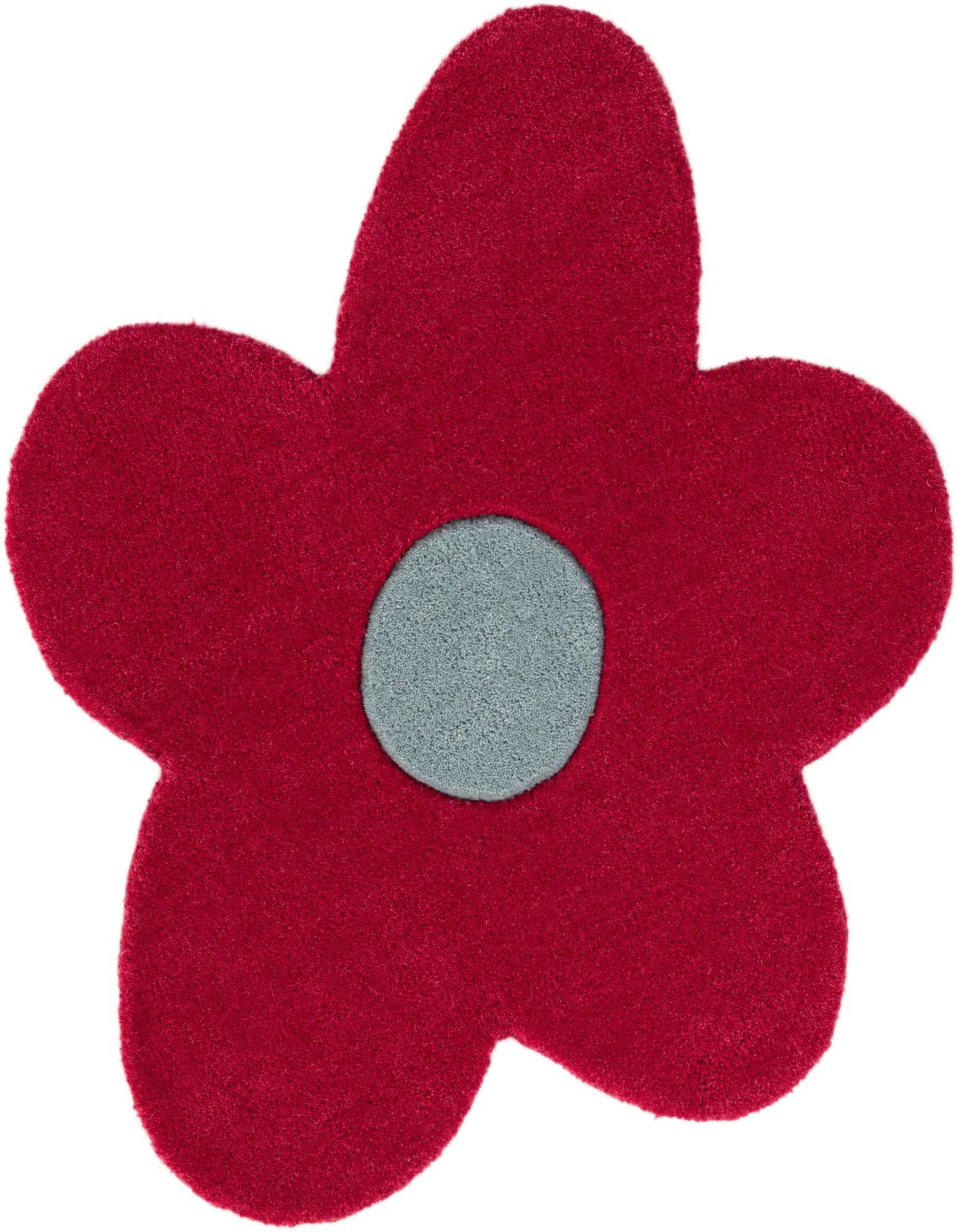 A vibrant red flower-shaped rug with a light blue circular center, featuring a high, soft pile.