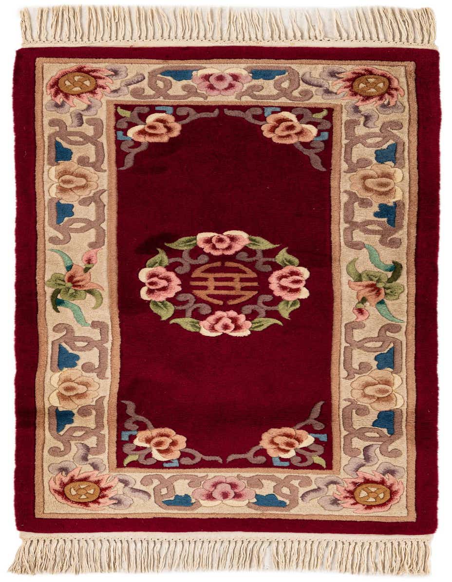 A 5 ft runner rug with a deep red field and an ornate floral border in pinks, creams, and blues, featuring a central medallion.
