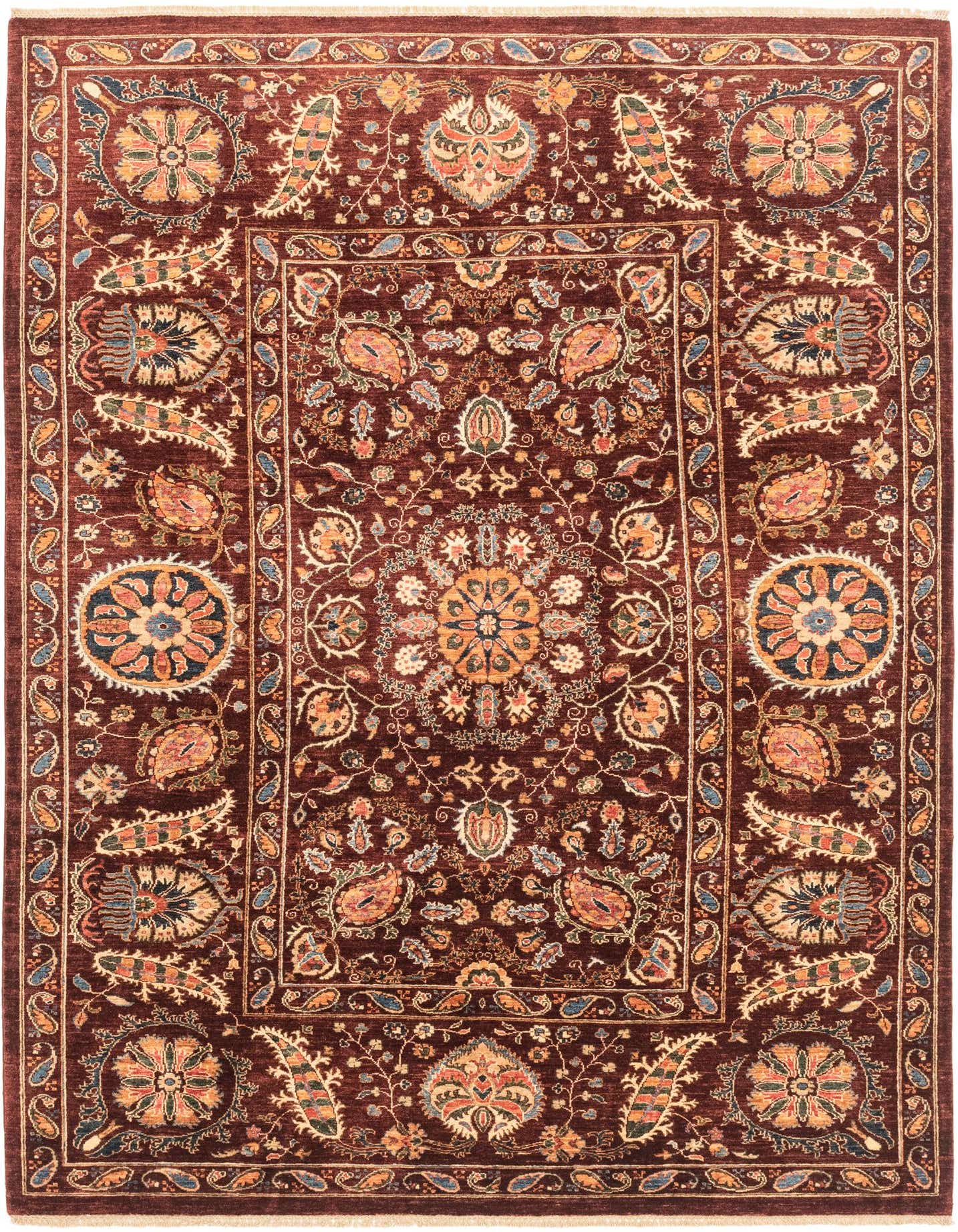 A 7x10 rectangular Ariana Ziegler rug featuring a rich red background with intricate traditional Southwestern and Oriental patterns in gold, blue, and cream.