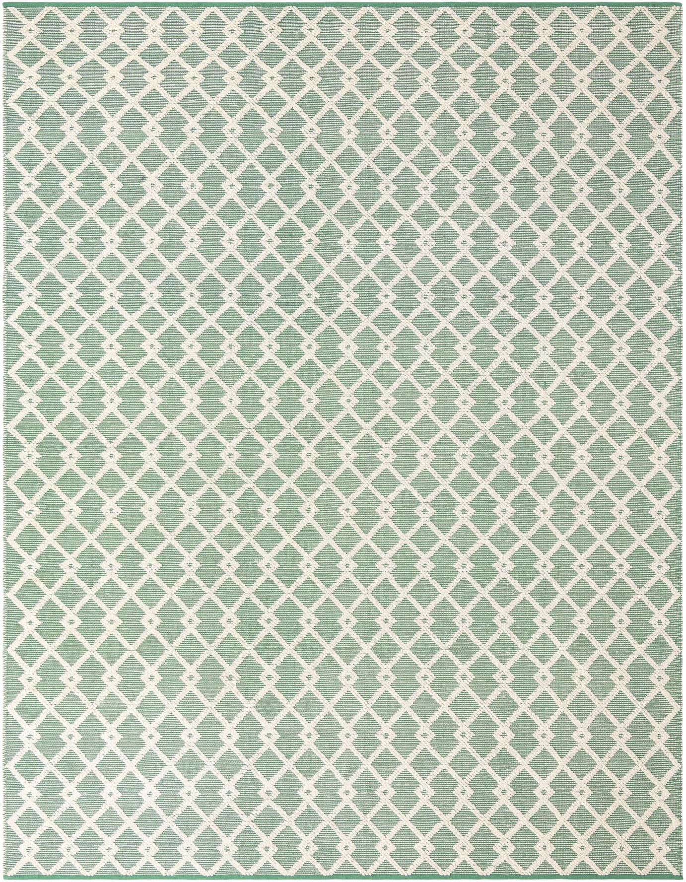 A 10x14 rectangular Jill Zarin Dorset rug featuring a modern abstract diamond pattern in greens and off-white, handmade with wool and cotton.