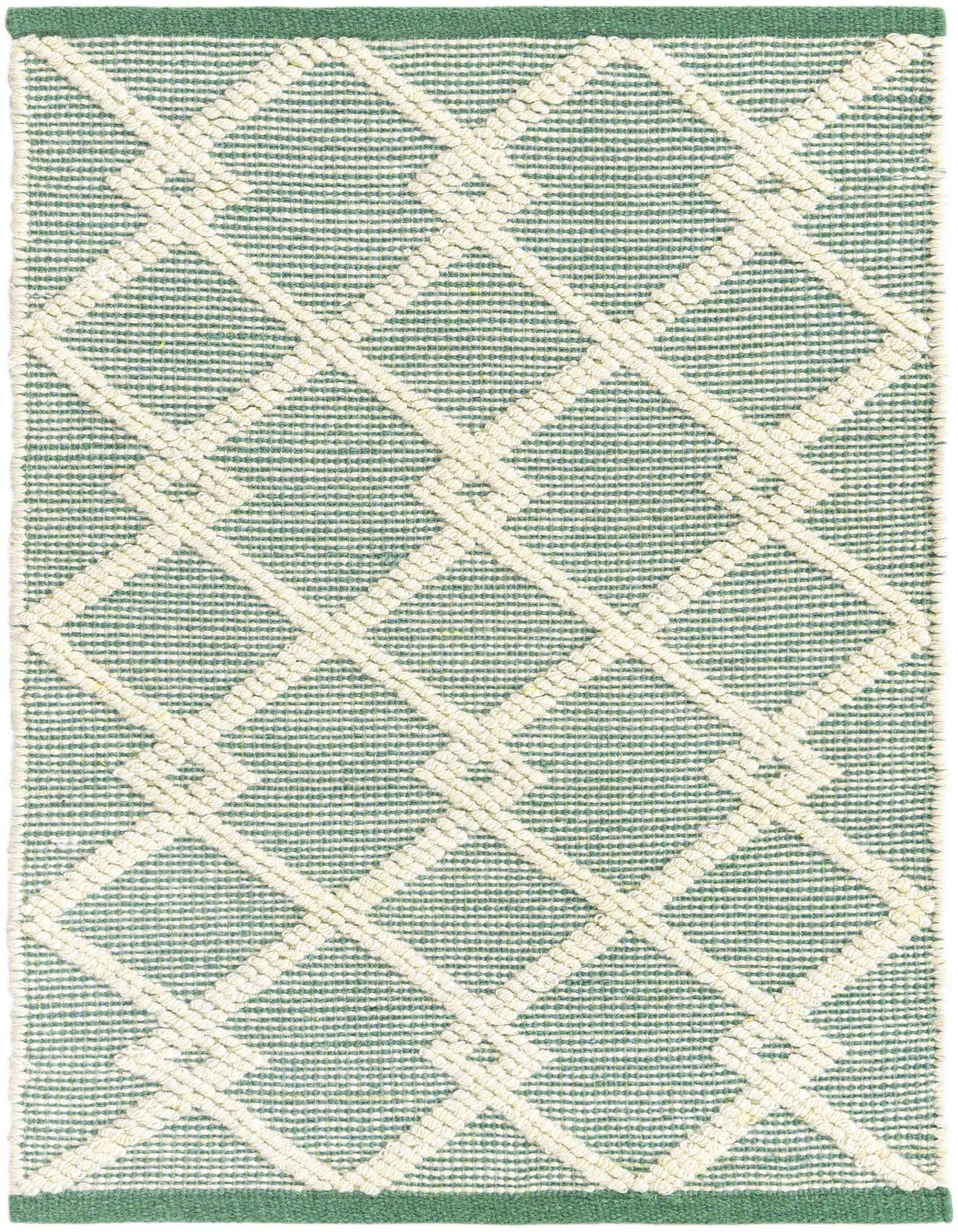A 2x3 rectangular Jill Zarin Dorset rug featuring a modern abstract diamond pattern in varying shades of green and off-white, with a textured, medium pile.