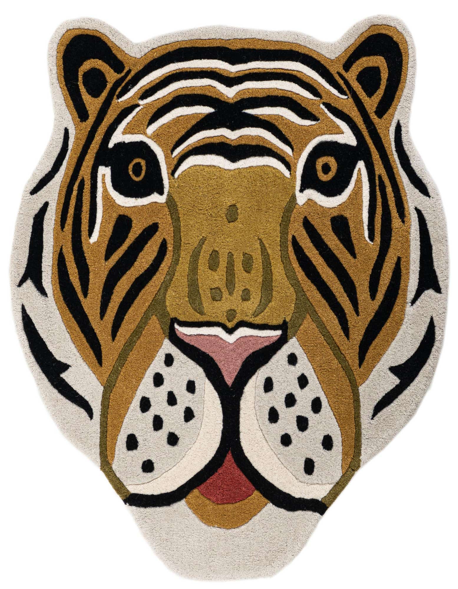 A close-up of a high-pile, freeform rug shaped like a tiger's head, featuring multi-colored wool in shades of brown, black, white, and pink.