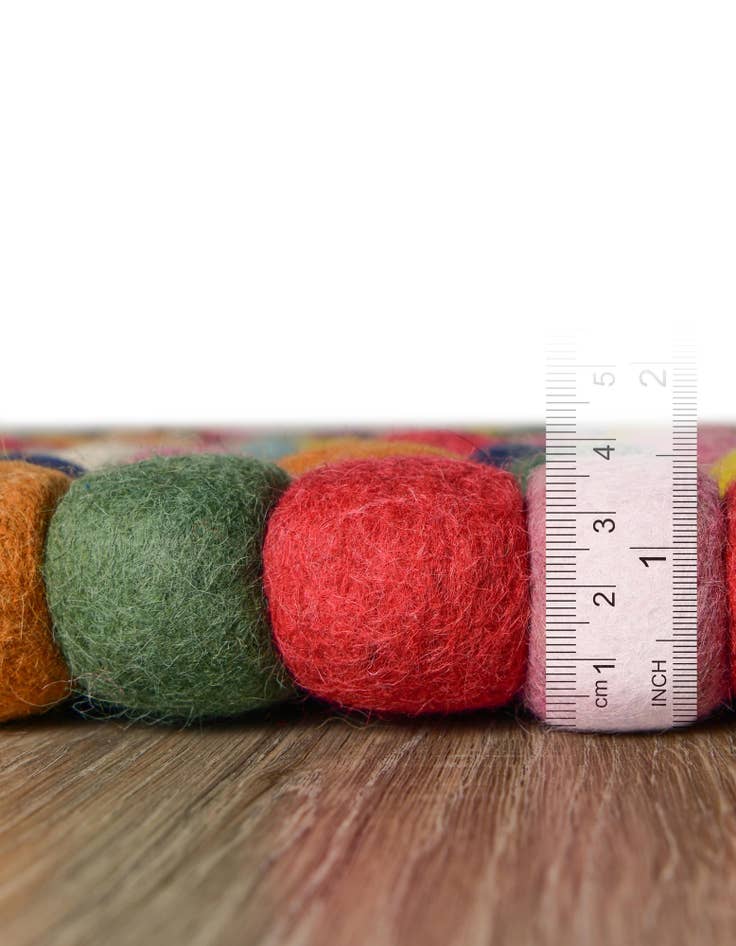 Detail image of  2' 2 x 3' 7 Felt Ball Wool Hearth Rug