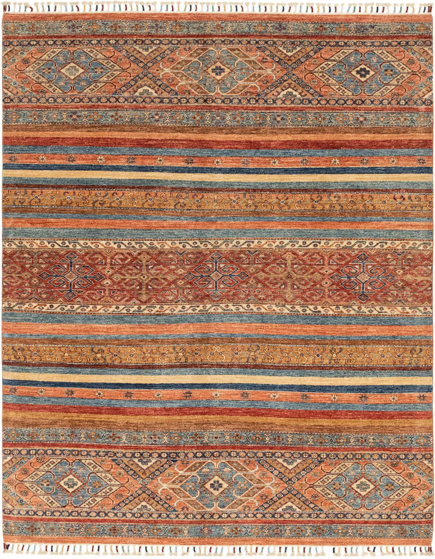 A 6x9 multi-colored rectangular Ariana Ziegler rug with Southwestern and tribal stripe patterns, featuring shades of red, blue, orange, and gold, suitable for a living room.