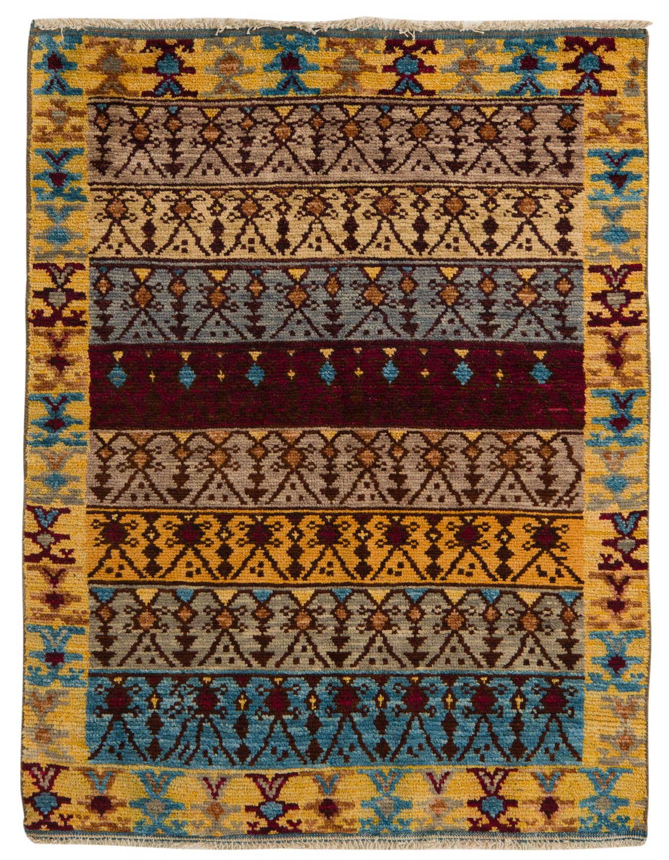 A 4x6 multi-colored rectangular wool rug with tribal and abstract patterns in yellow, blue, brown, and red hues.