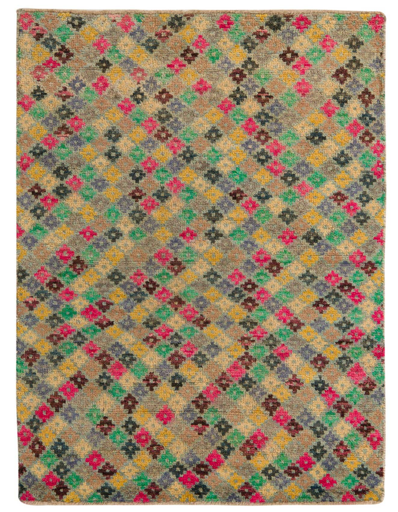 A 4x6 multi-colored rectangular wool rug with a vibrant tribal, abstract pattern, featuring small diamond shapes in pink, green, yellow, and brown.