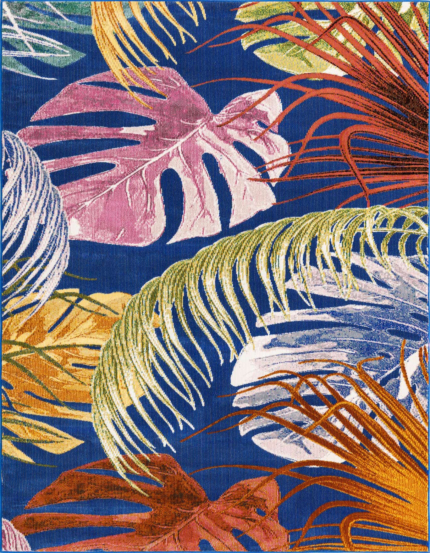 A vibrant 10x14 rectangular rug with a multi-colored tropical leaf pattern on a deep blue background, featuring pink monstera, green palm fronds, and orange leaves.