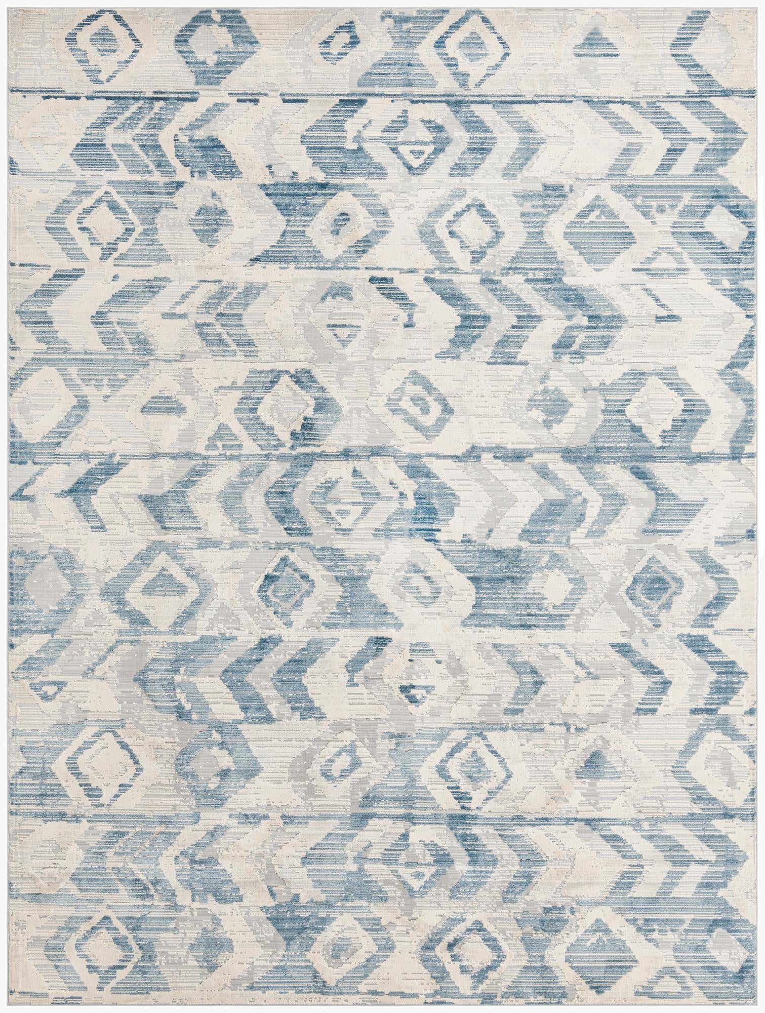 A 9x12 rectangular indoor area rug with a textured pile, featuring a distressed blue and off-white tribal pattern.