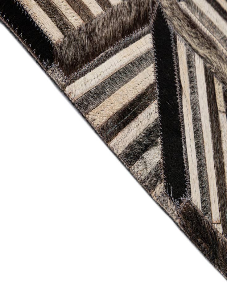 Detail image of  4' 11 x 7' 10 Cowhide - Patchwork Rug