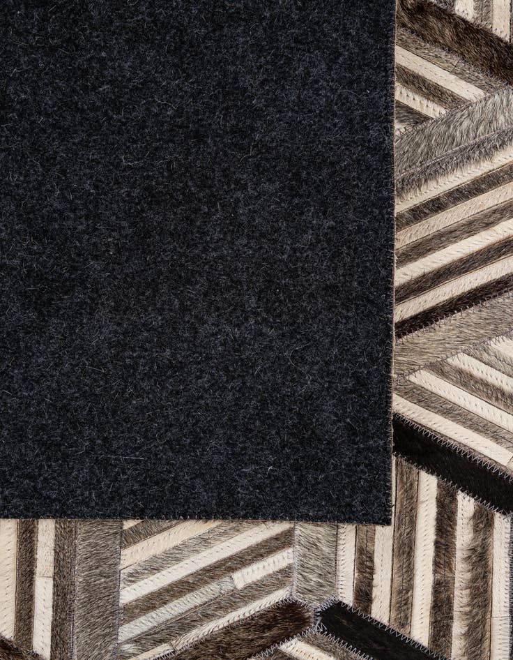 Detail image of  4' 11 x 7' 10 Cowhide - Patchwork Rug