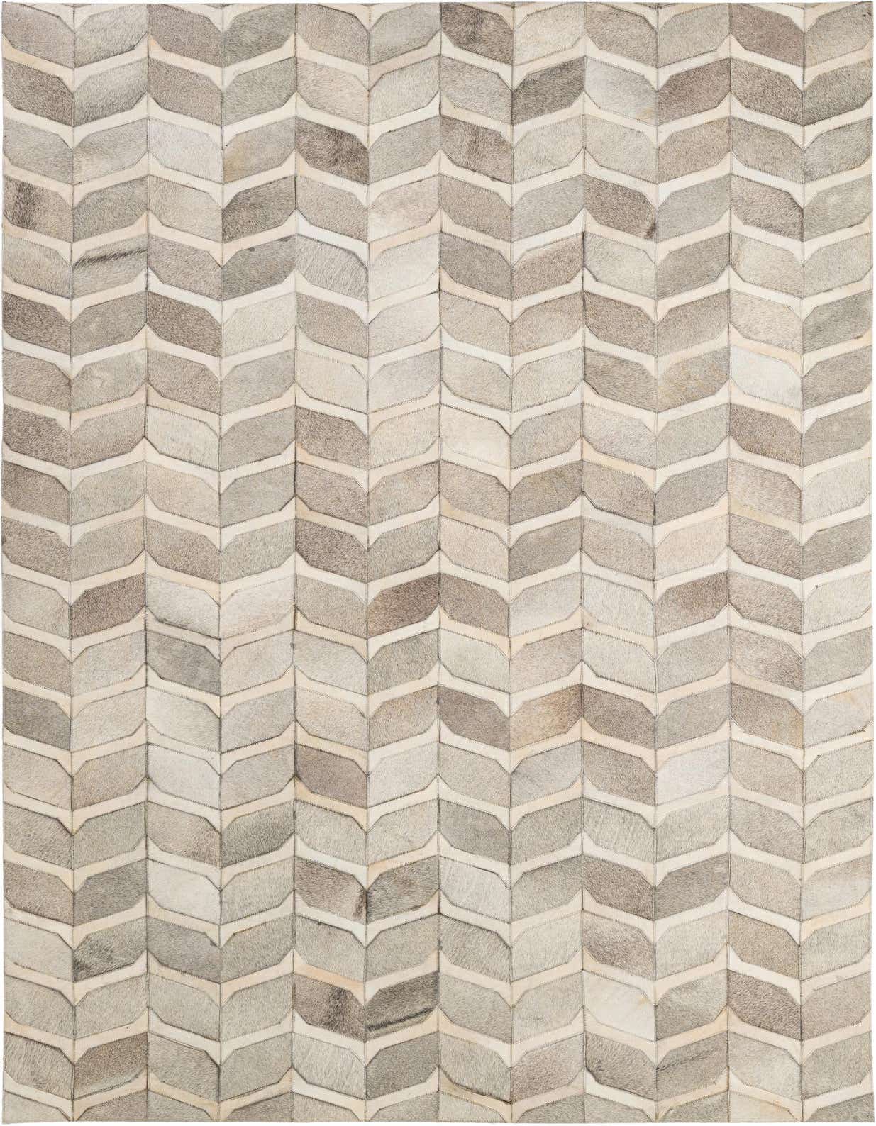 A rectangular 5x8 modern cowhide rug featuring a chevron patchwork pattern in varying shades of light gray and beige.