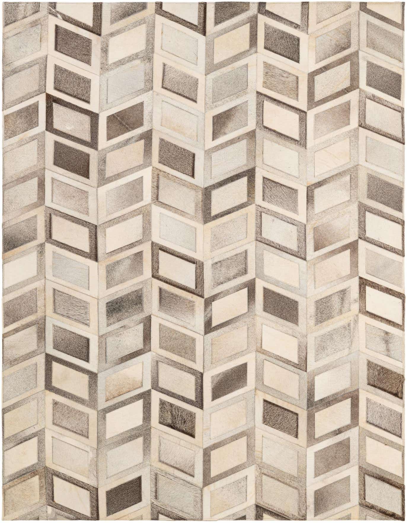 A 5x7 rectangular Cowhide - Patchwork rug featuring a modern geometric pattern of multi-colored diamond shapes in varying shades of brown, beige, and gray.