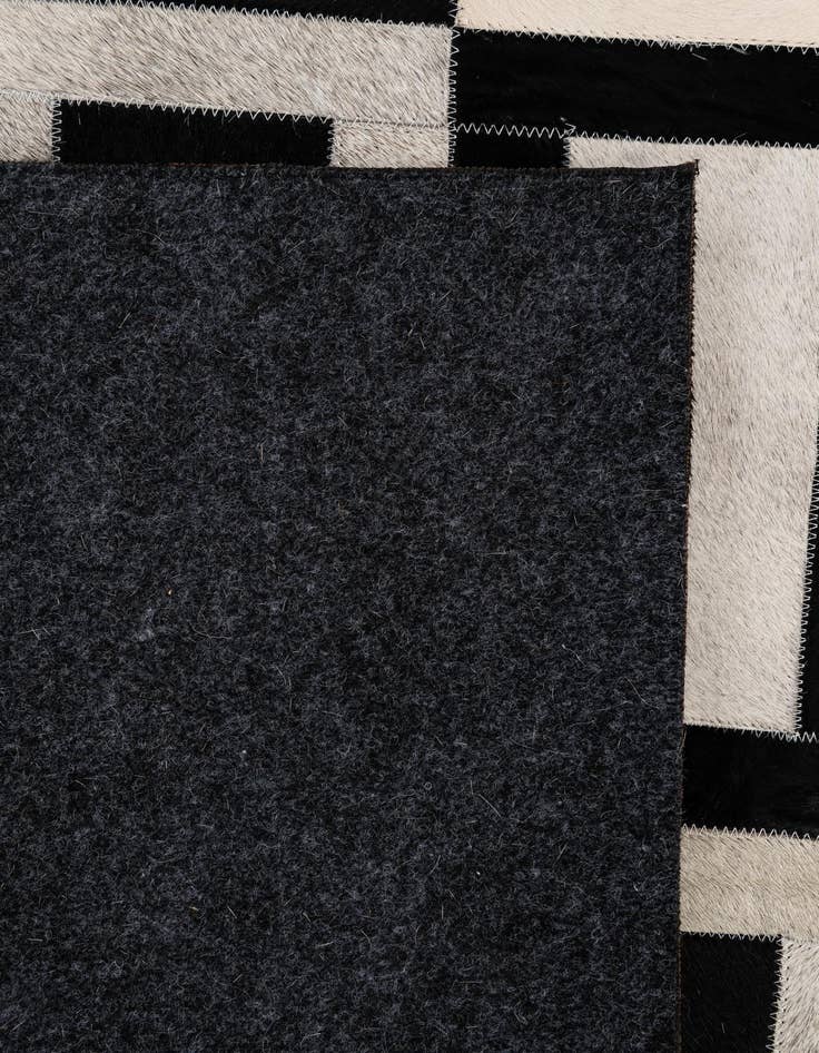 Detail image of  5' 1 x 7' 11 Cowhide - Patchwork Rug