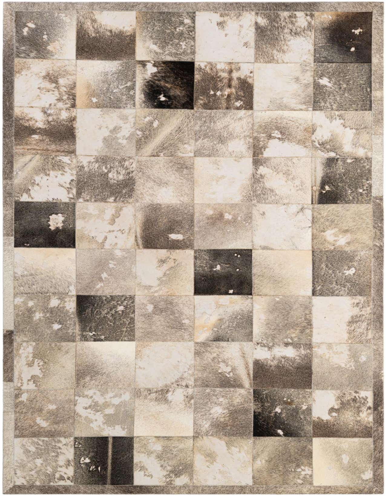 A 5x8 rectangular Cowhide Patchwork rug featuring multi-colored squares of natural cowhide in shades of grey, white, and black, with a medium pile.