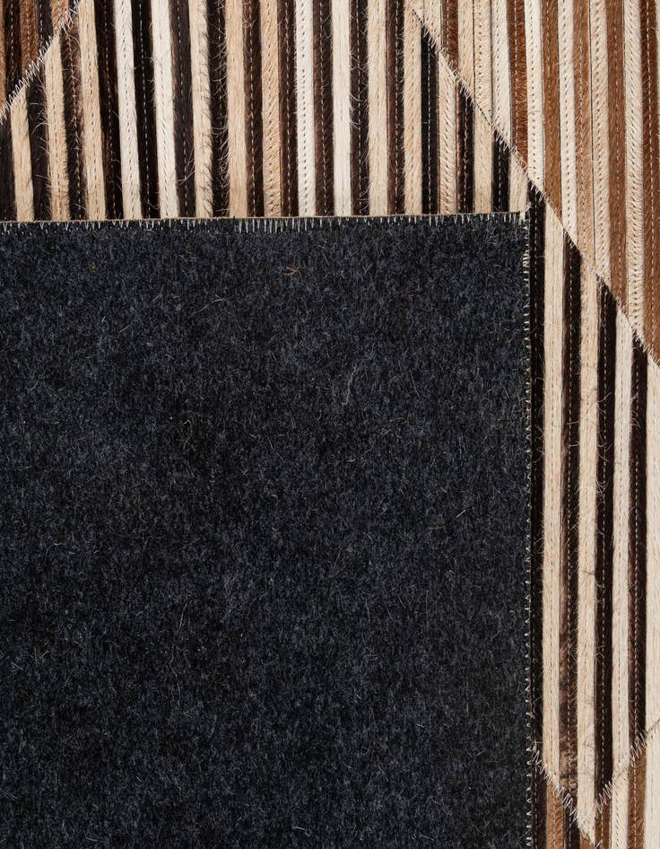 Detail image of  5' 1 x 8' 3 Cowhide - Patchwork Rug