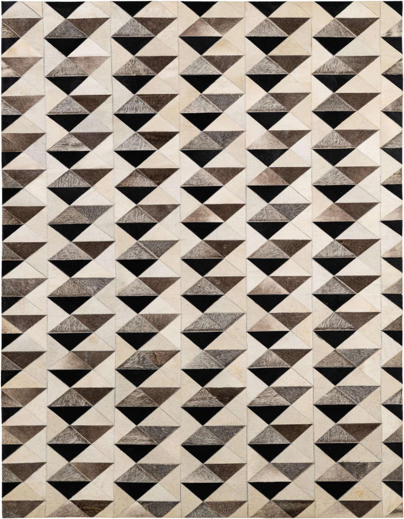 A 5x8 rectangular cowhide rug with a modern geometric pattern of multi-colored triangles in black, brown, and cream.