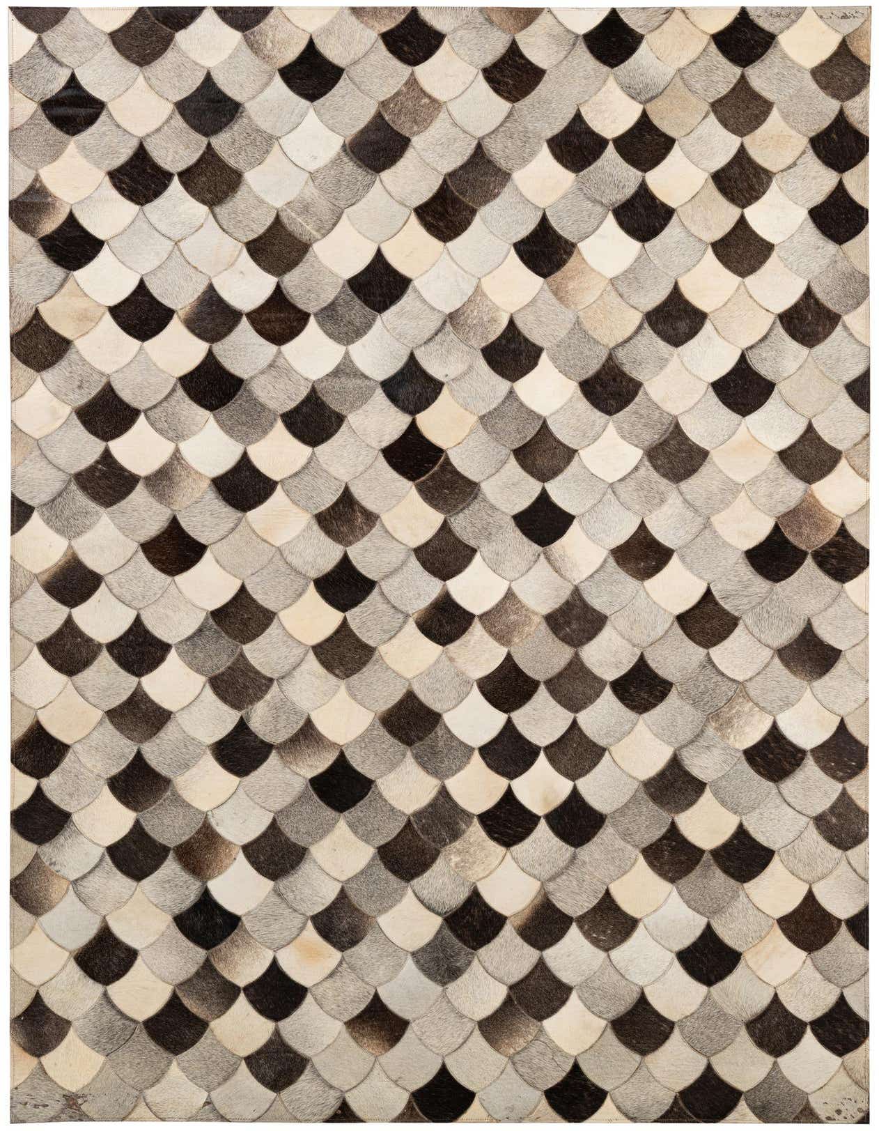 A 5x8 rectangular Cowhide Patchwork rug featuring a modern scalloped pattern in multi-colored natural cowhide and leather.