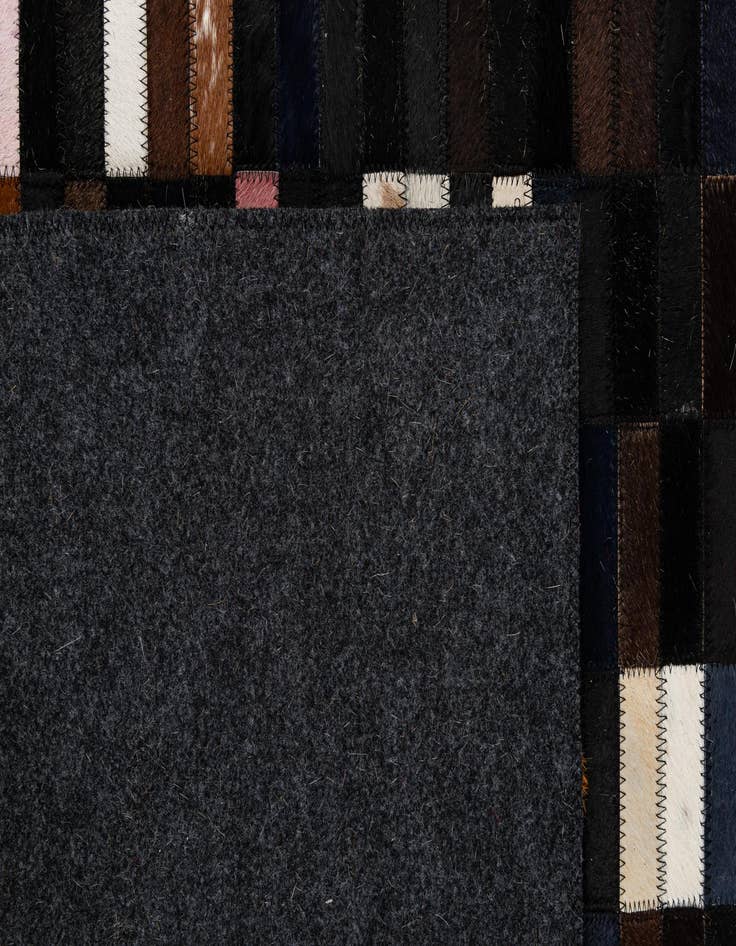 Detail image of  5' 2 x 7' 11 Cowhide - Patchwork Rug