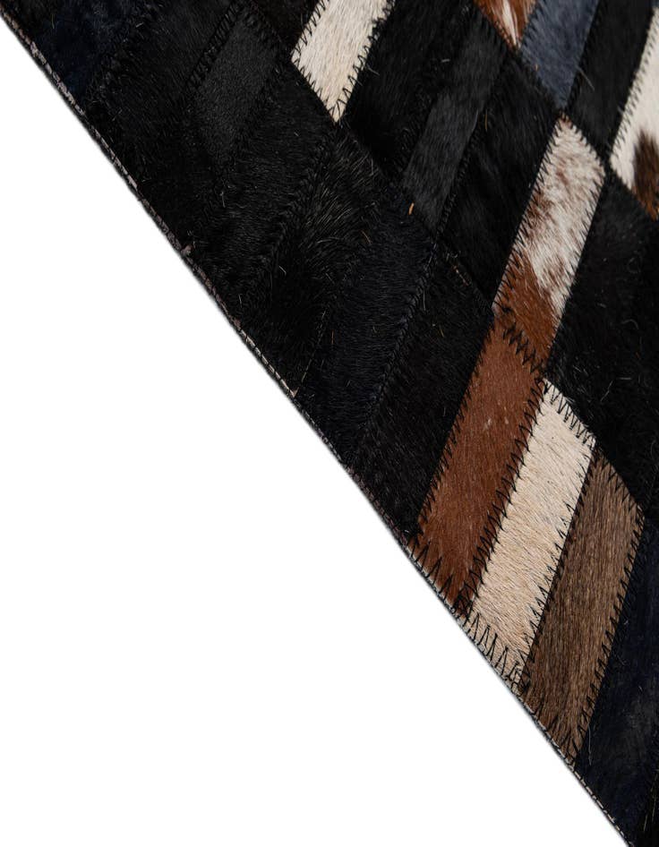 Detail image of  5' 2 x 7' 11 Cowhide - Patchwork Rug