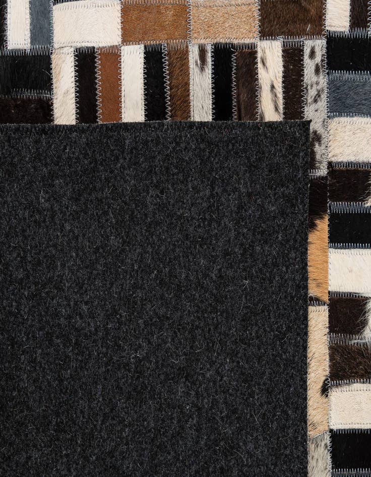 Detail image of  5' 1 x 7' 11 Cowhide - Patchwork Rug