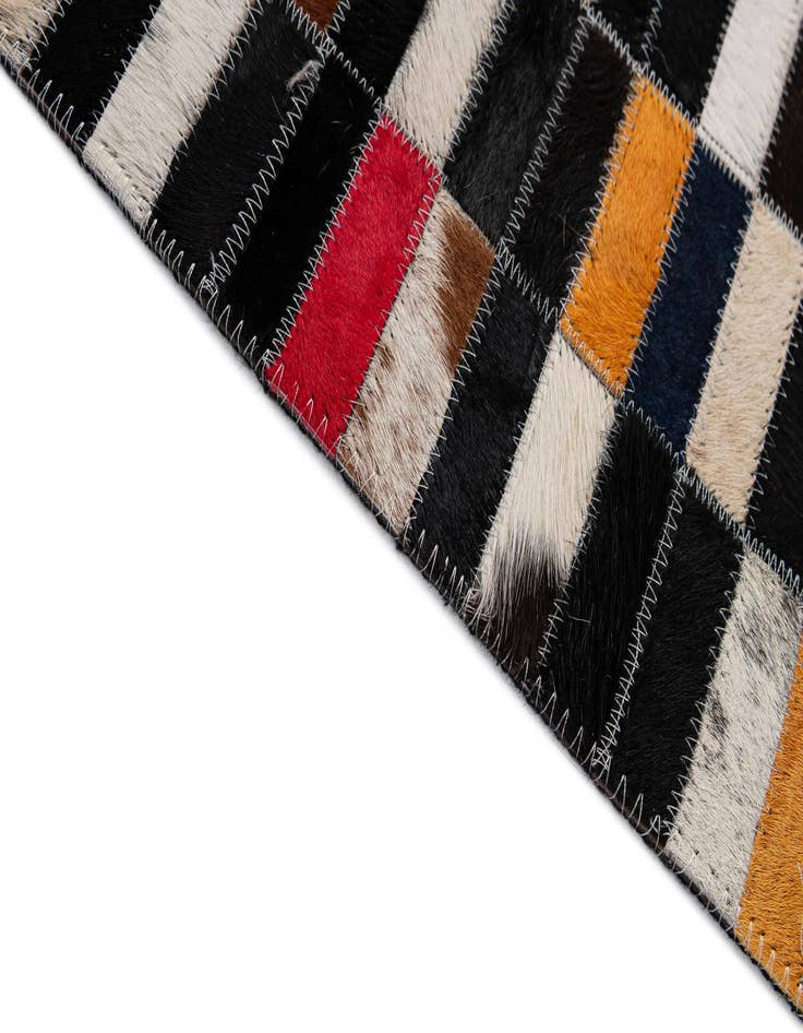 Detail image of  5' 1 x 7' 11 Cowhide - Patchwork Rug