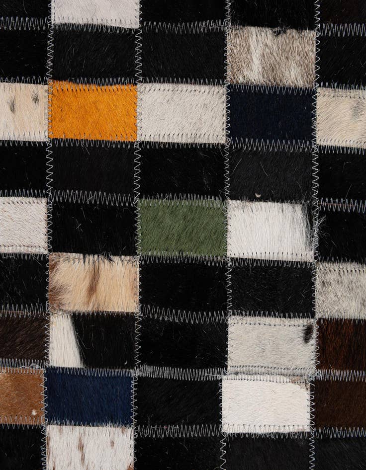 Detail image of  5' 1 x 7' 11 Cowhide - Patchwork Rug