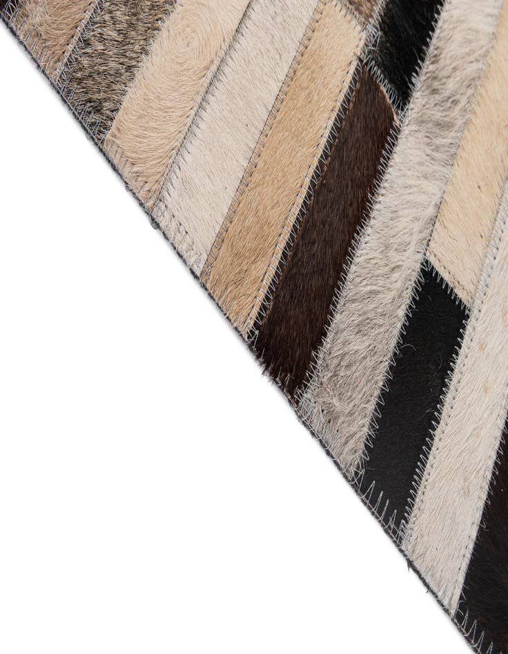 Detail image of  5' 1 x 7' 11 Cowhide - Patchwork Rug