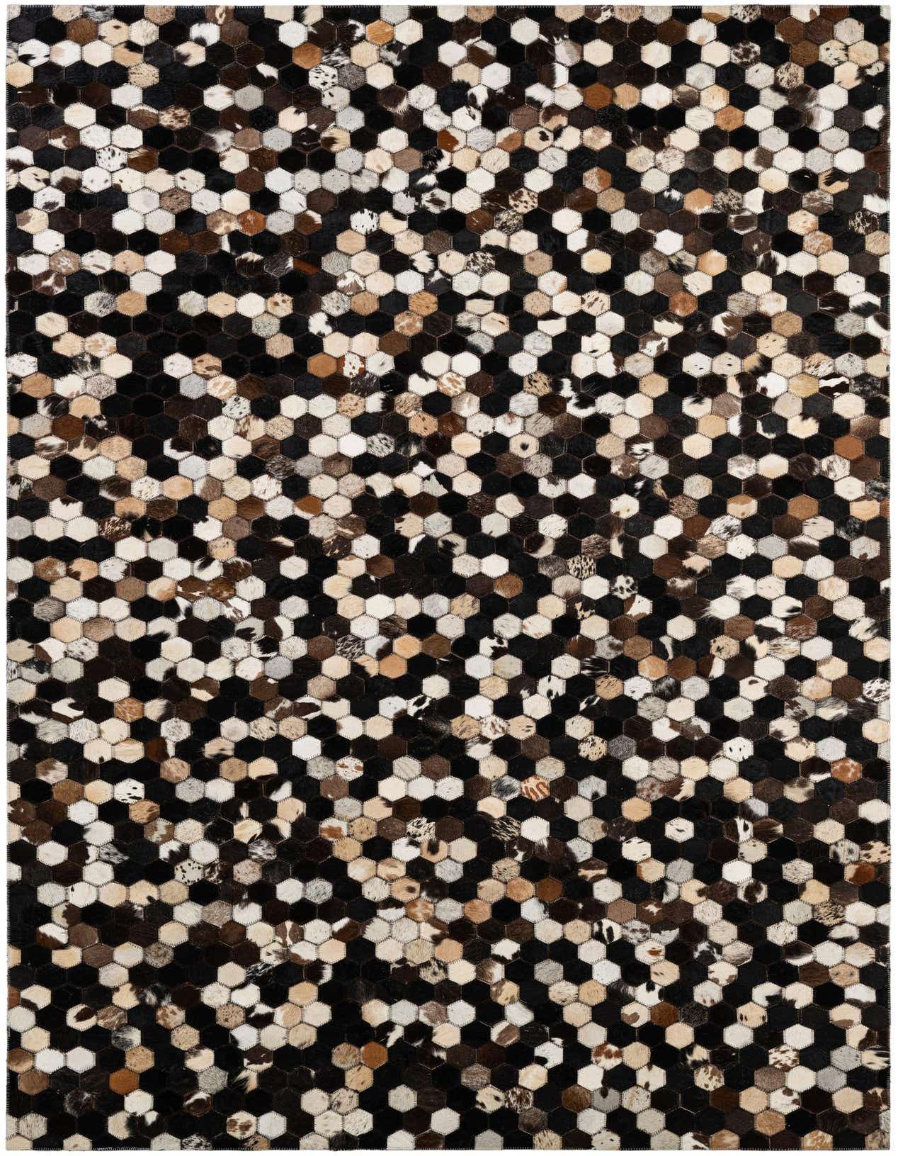 A 5x8 rectangular Cowhide Patchwork rug featuring a modern hexagonal pattern in multi-colored natural cowhide and black.
