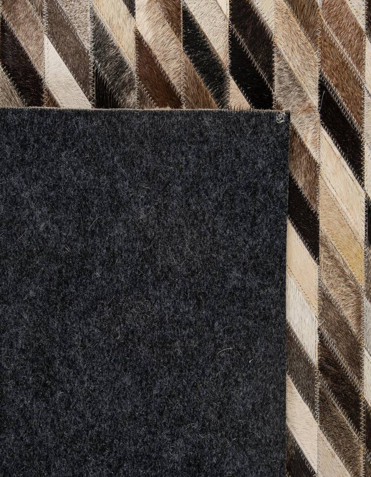 Detail image of  5' 1 x 7' 11 Cowhide - Patchwork Rug