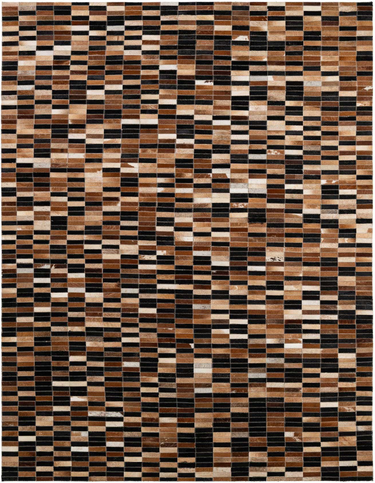 A 5x8 rectangular modern rug made from patchwork cowhide and leather in varying shades of black, brown, and tan.