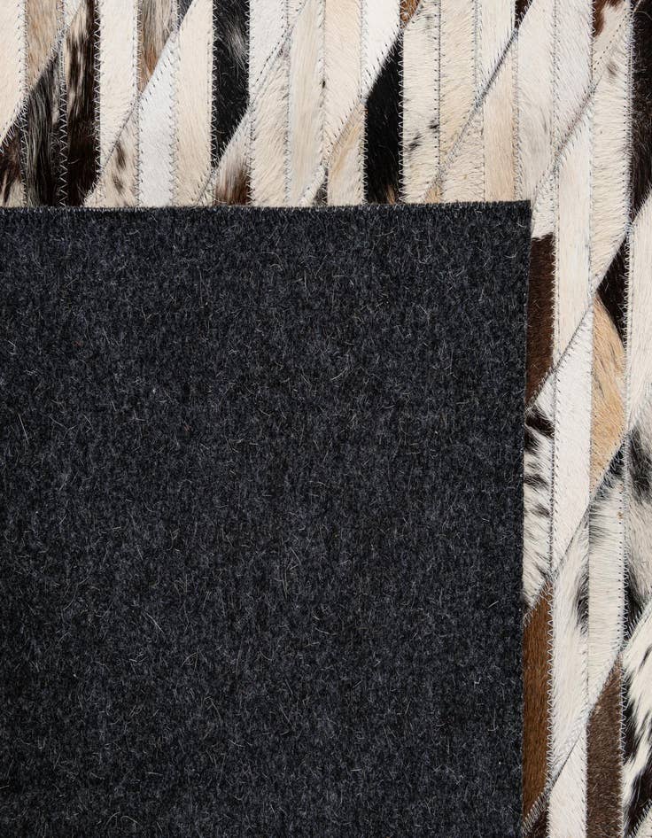 Detail image of  5' 1 x 7' 10 Cowhide - Patchwork Rug
