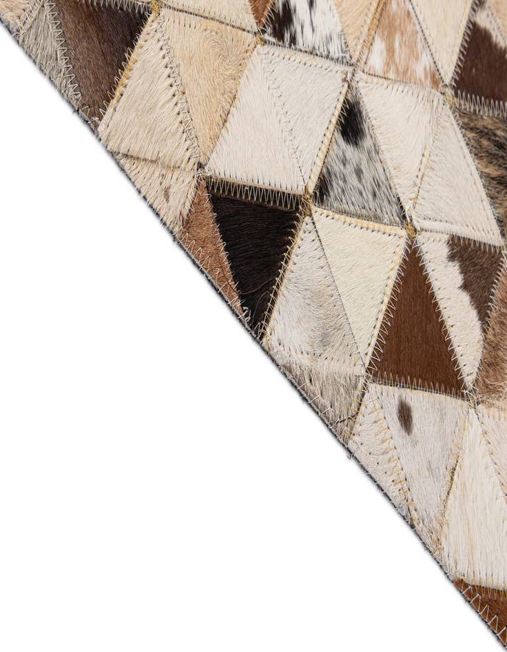 Detail image of  5' 1 x 7' 11 Cowhide - Patchwork Rug