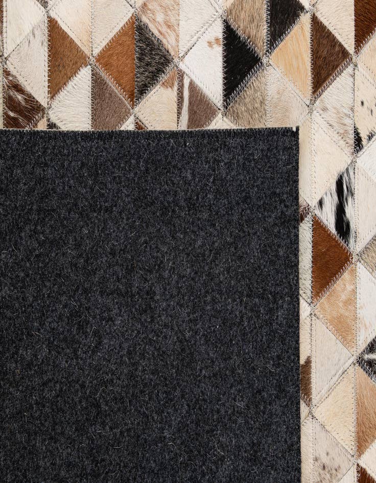 Detail image of  5' 1 x 7' 11 Cowhide - Patchwork Rug