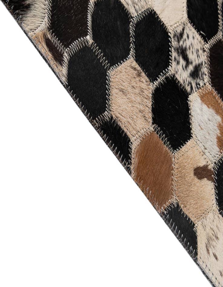 Detail image of  5' 1 x 7' 11 Cowhide - Patchwork Rug