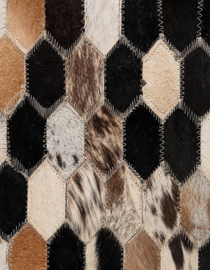Detail image of  5' 1 x 7' 11 Cowhide - Patchwork Rug