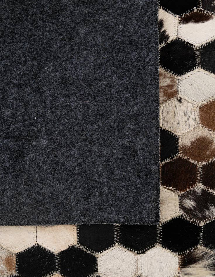 Detail image of  5' 1 x 7' 11 Cowhide - Patchwork Rug