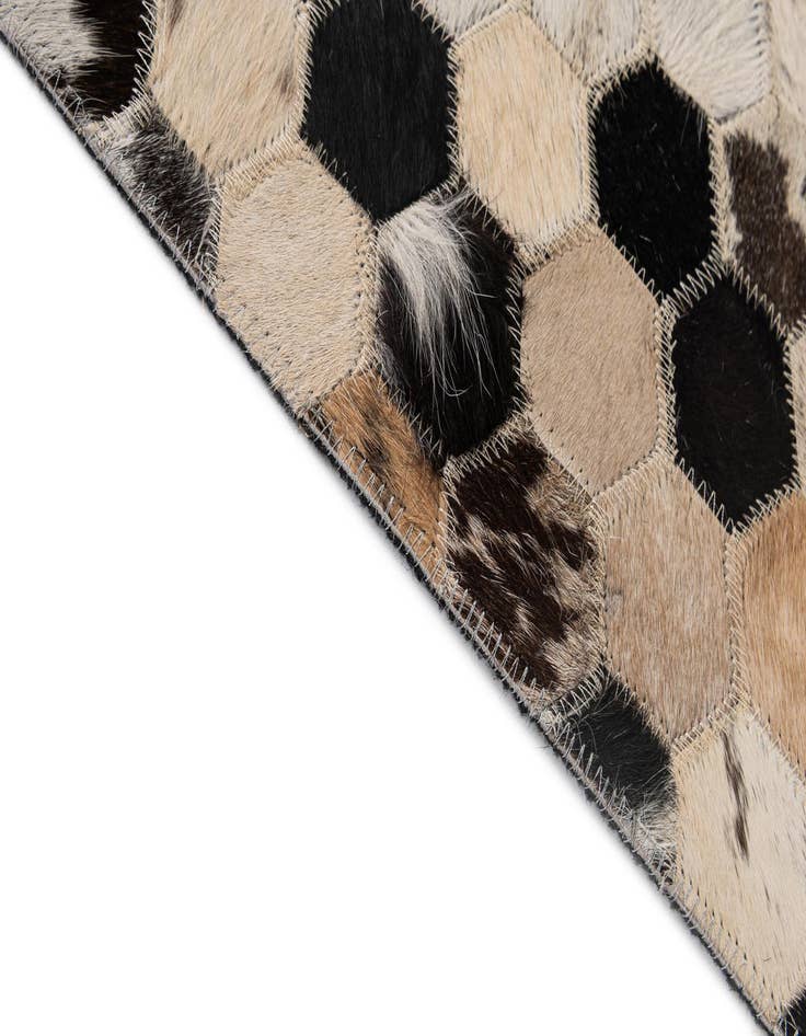 Detail image of  5' 1 x 7' 11 Cowhide - Patchwork Rug