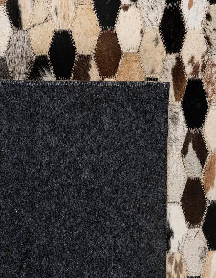 Detail image of  5' 1 x 7' 11 Cowhide - Patchwork Rug
