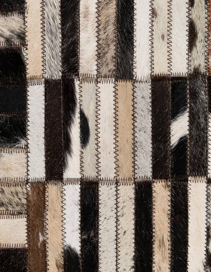 Detail image of  4' 11 x 7' 10 Cowhide - Patchwork Rug