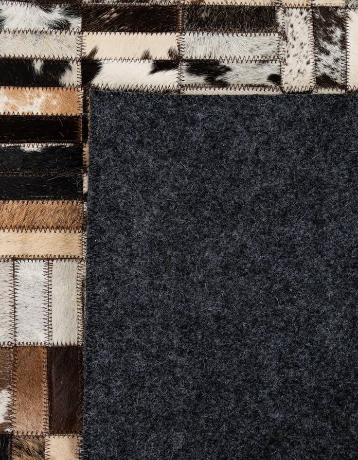 Detail image of  4' 11 x 7' 10 Cowhide - Patchwork Rug