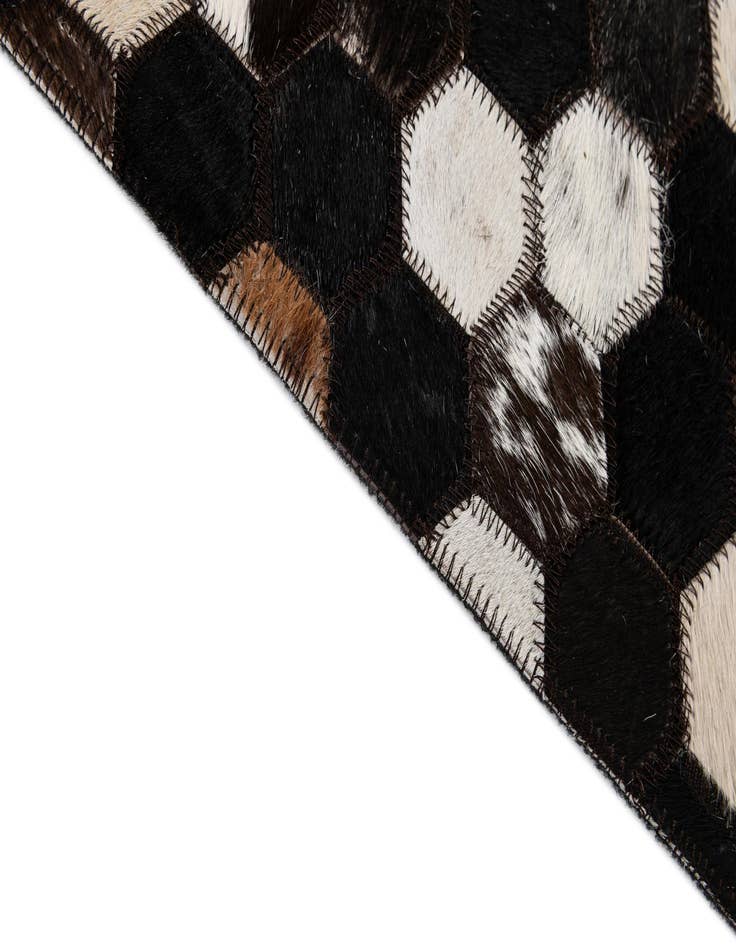 Detail image of  5' 2 x 7' 11 Cowhide - Patchwork Rug