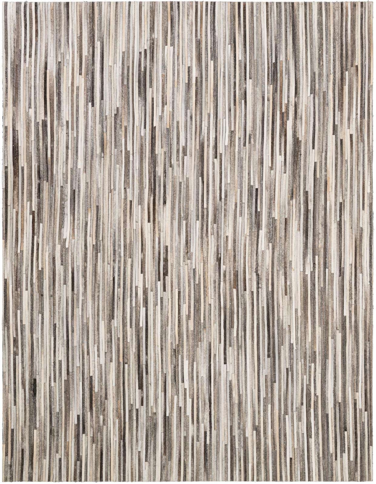 A 5x8 rectangular Cowhide Patchwork rug featuring vertical stripes in various shades of gray, white, and brown.