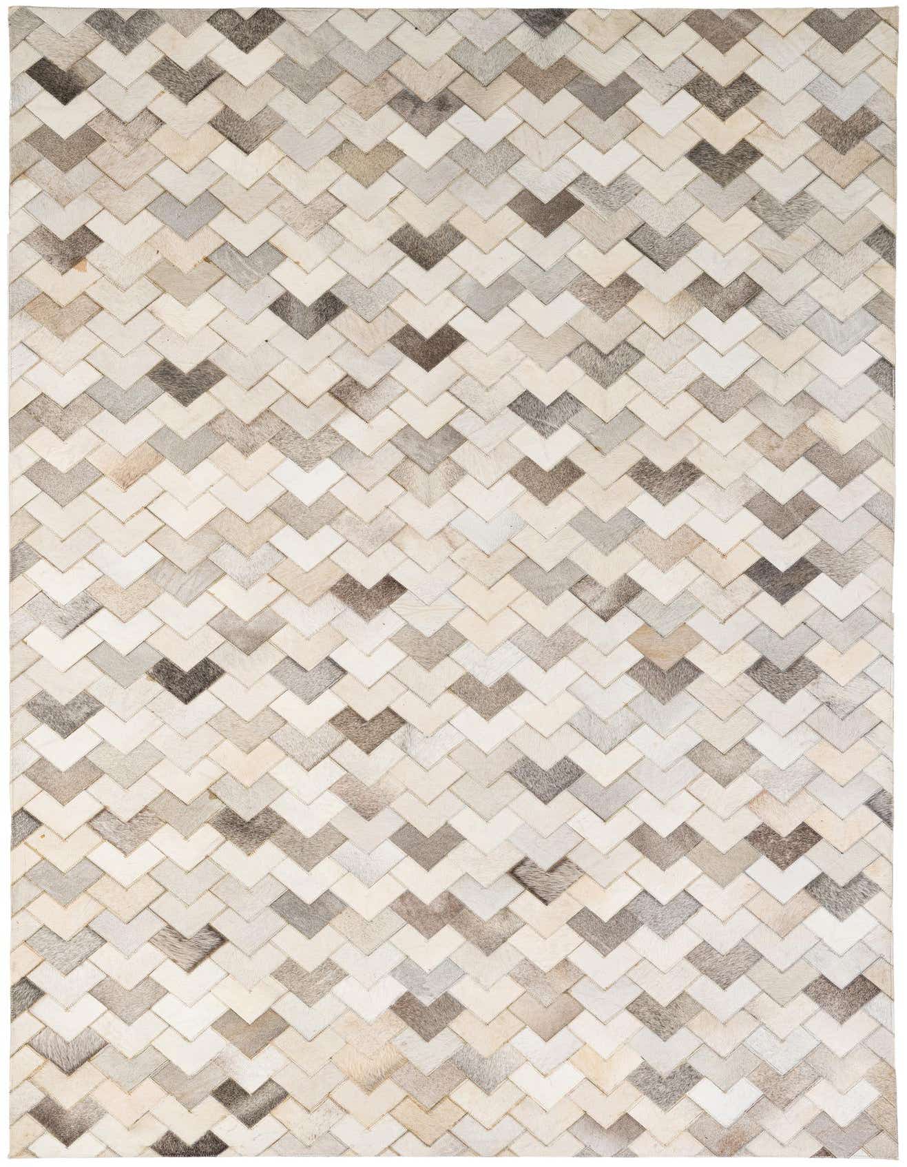 A 5x8 rectangular Cowhide Patchwork rug featuring a modern chevron pattern in various shades of multi-colored natural cowhide.