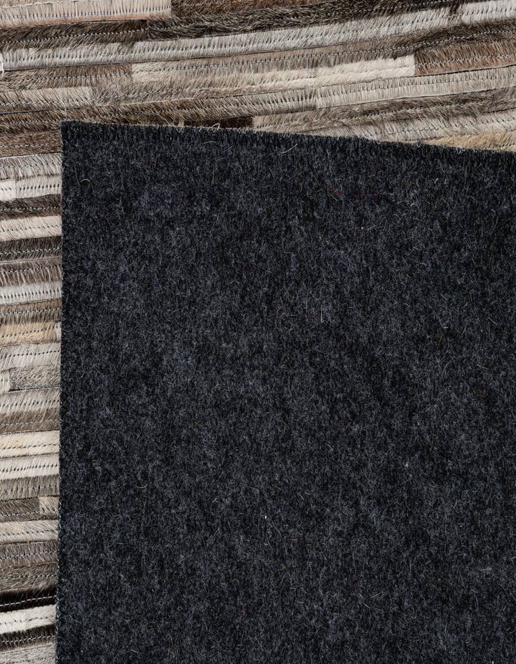 Detail image of  5' 1 x 7' 11 Cowhide - Patchwork Rug