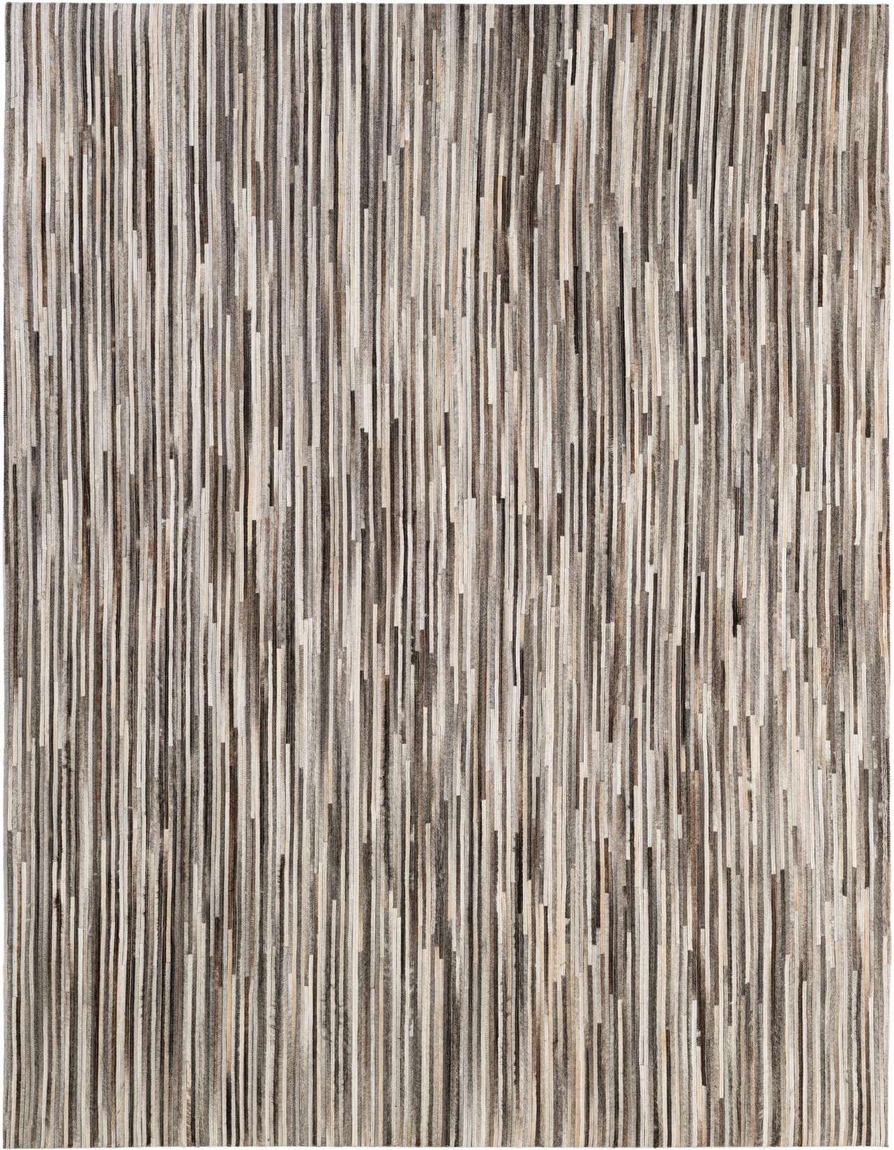 A 5x8 rectangular Cowhide Patchwork rug with vertical stripes in various shades of brown, black, and white.